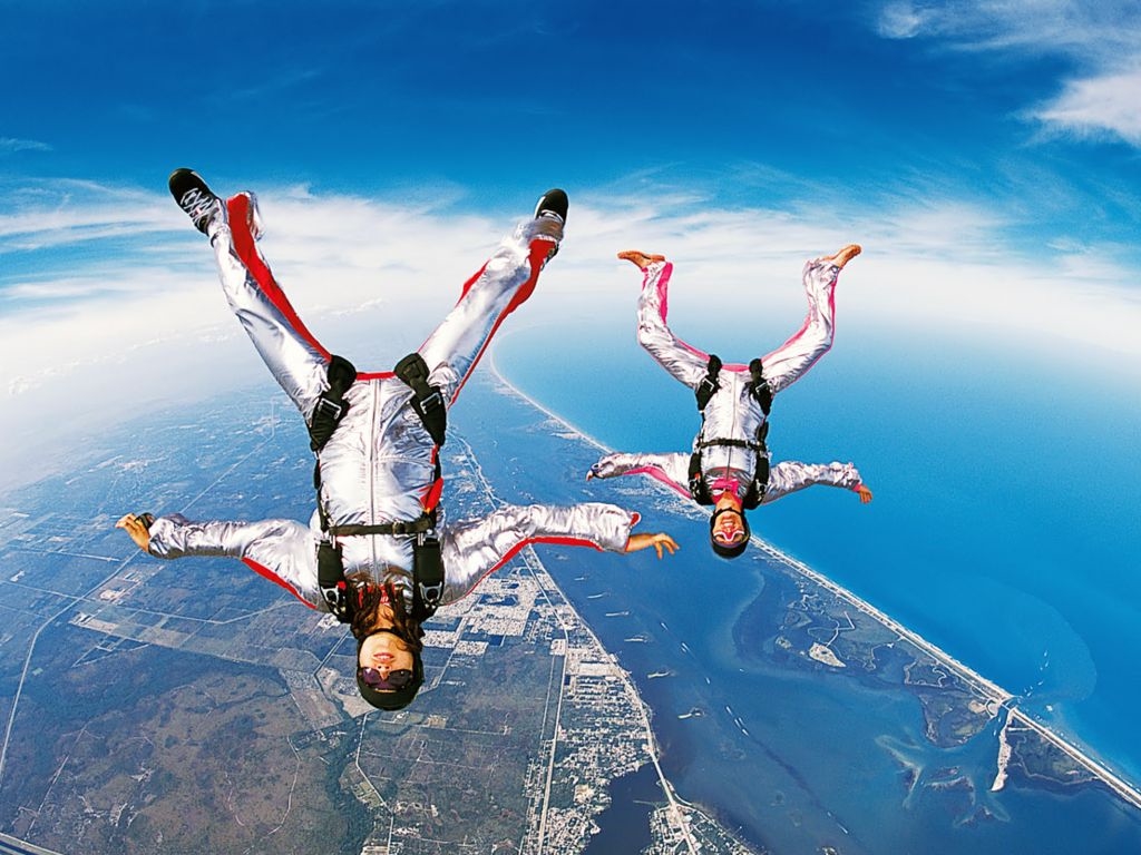upside couple appearing to be skydiving