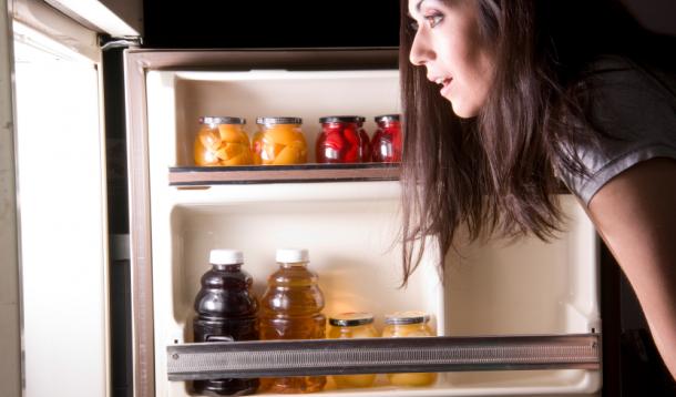 girl looking in fridge