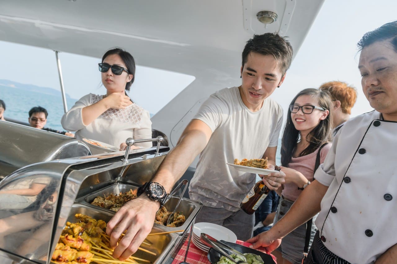 Contest winners of the first Tiger White Expect the Unexpected experience was surprised with a buffet spread served on a yacht in Port Dickson.