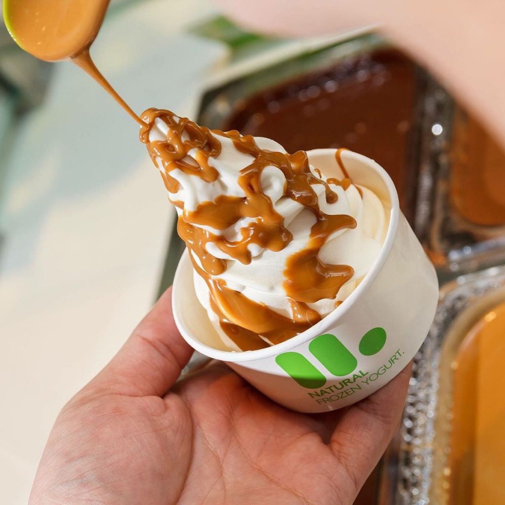 A tub of llaollao frozen yoghurt drizzled with signature caramelised biscuit sauce (2)