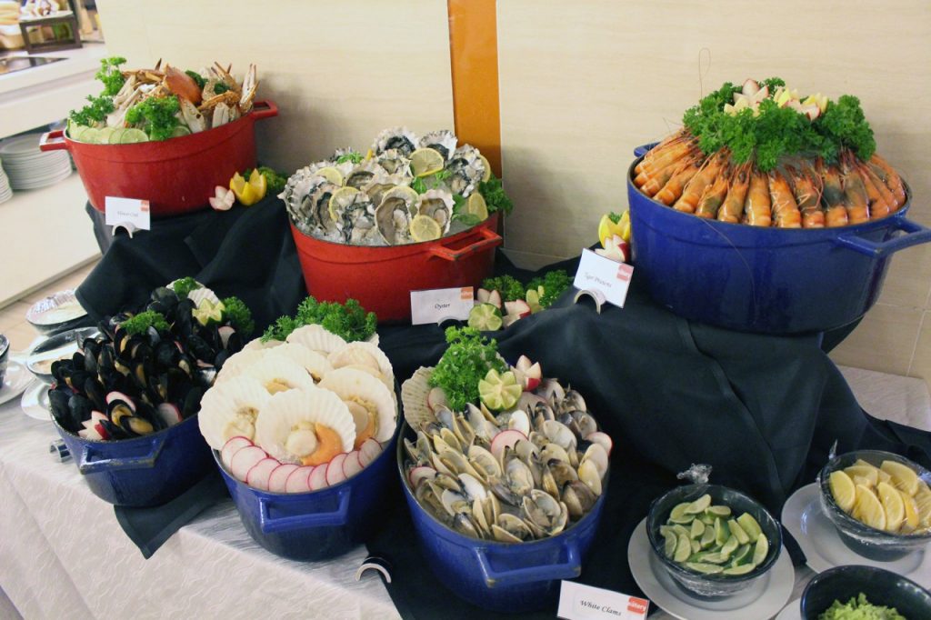 Gourmet Crustacean - (Clockwise from top left) Flower Crabs, US Oysters, Tiger Prawns, White Clams, Half Shell Scallops, Marinated Black Mussels with Lmon Wedges, Mignonette and Cocktail Sauce (1)