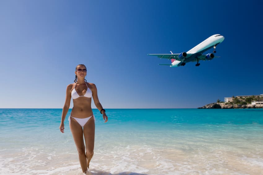 young woman enjoying her vacation at the beach in Saint Martin